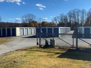 A lot of storage units in an empty parking lot.